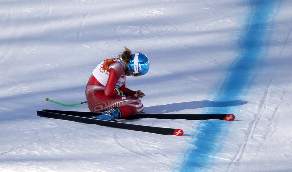 Switzerland's Nadja Jnglin-Kamer sits after crashing near the finish line during a women's downhill training run for the Sochi 2014 Winter Olympics, Saturday, Feb. 8, 2014, in Krasnaya Polyana, Russia.(AP Photo/Christophe Ena)