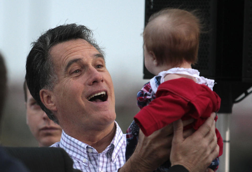 Republican presidential candidate and former Massachusetts Governor Mitt Romney holds the baby of a supporter during a campaign rally at the Port of Pascagoula in Pascagoula, Mississippi, March 8, 2012. (Dan Anderson/Reuters)