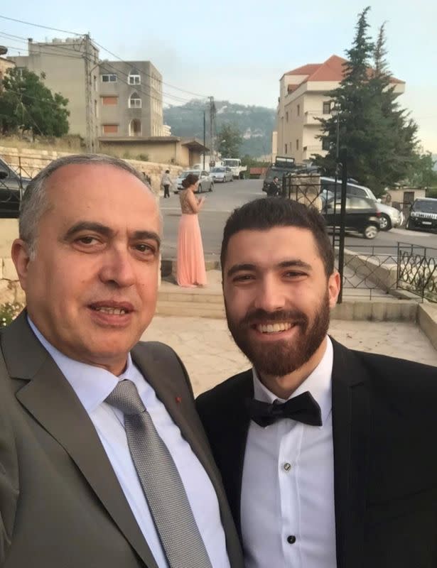 Colonel Joseph Skaf, a retired customs official who died in 2017, poses for a photo with his son, Michel Skaf in this undated handout photo in the town of Jezzine
