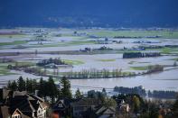 <p>A view of flooding in the Sumas Prairie area of Abbotsford British Columbia, Canada, on November 17, 2021. (Photo by Don MacKinnon / AFP) (Photo by DON MACKINNON/AFP via Getty Images)</p> 