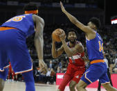 Washington Wizards guard Chasson Randle (9) drives to the basket as New York Knicks guard Allonzo Trier (14) defends, during an NBA basketball game between New York Knicks and Washington Wizards at the O2 Arena, in London, Thursday, Jan.17, 2019. (AP Photo/Alastair Grant)