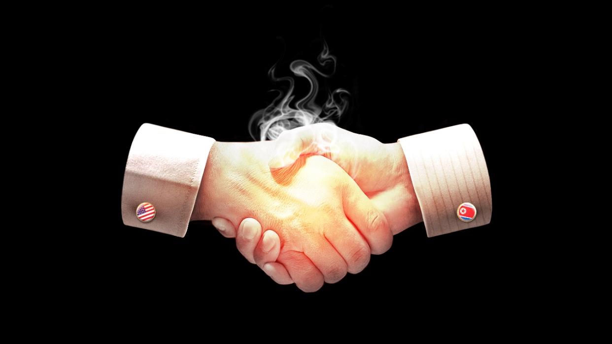 An illustration shows two parties shaking hands, with one hand representing the U.S., indicated with a cufflink showing the U.S. flag, and the other hand representing North Korea, indicated with a cufflink showing the flag of North Korea.
