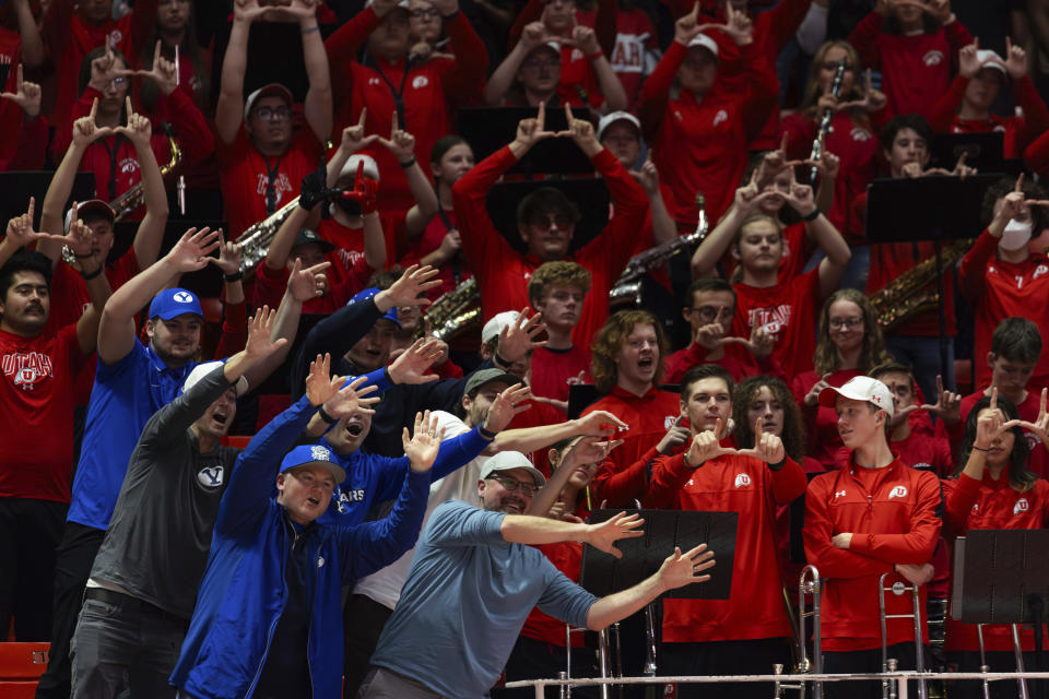 Utah and BYU fans cheer during a free throw at an NCAA college basketball game in Salt Lake City, Saturday, Dec. 9, 2023. (Megan Nielsen/The Deseret News via AP)