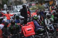 Delivery workers for Rappi and other delivery apps protest as part of a strike to demand better wages and working conditions, amid the coronavirus disease (COVID-19) outbreak, in Bogota