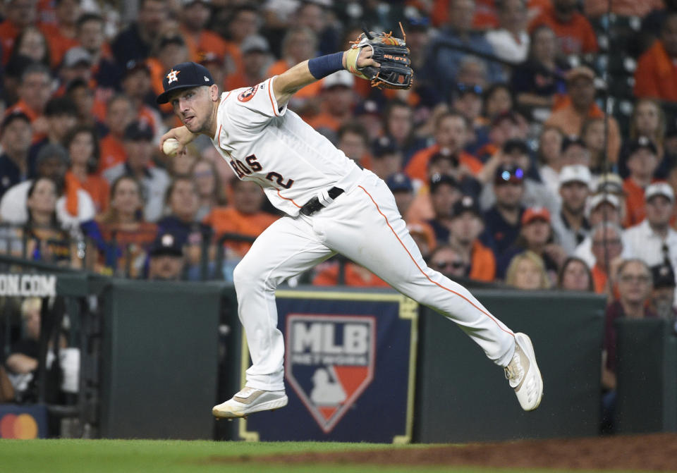 FILE - In this Oct. 4, 2019, file photo, Houston Astros third baseman Alex Bregman looks to first after fielding a grounder by Tampa Bay Rays' Tommy Pham, who was safe at first in the seventh inning during Game 1 of a baseball American League Division Series in Houston. If Bregman is the American League’s Most Valuable Player when the voting is announced Thursday, Nov. 14, the Astros will become the first team to have an MVP, Cy Young Award winner and Rookie of the Year in the same season. Justin Verlander took Cy Young honors, and Yordan Alvarez was picked as the AL’s top rookie. AP Photo/Eric Christian Smith, File)