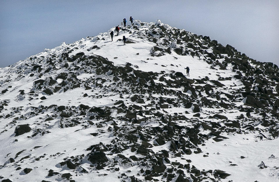 In this Friday, April 4, 2014 photo, climbers make their way to the summit of the 5,798-foot high Mount Adams. (AP Photo/Robert F. Bukaty)