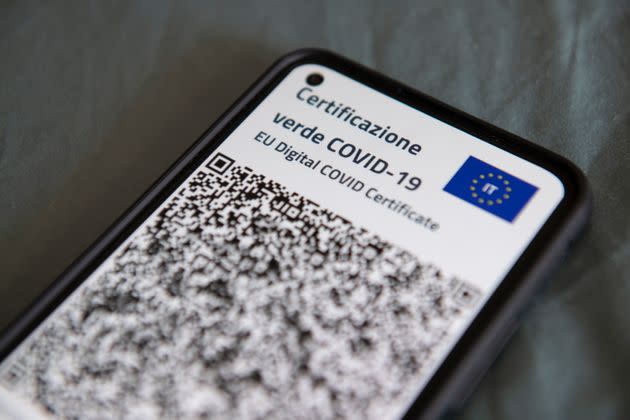 TURIN, ITALY - JUNE 30: A close-up view of Italy's Covid-19 Green Pass for post-vaccine travel on a smartphone on June 30, 2021 in Turin, Italy. The digital health certificate, or Green Pass, was officially launched by Italian Prime Minister Draghi, allowing people to access certain events and facilities in Italy as well as travel domestically and abroad. (Photo by Stefano Guidi/Getty Images) (Photo: Stefano Guidi via Getty Images)