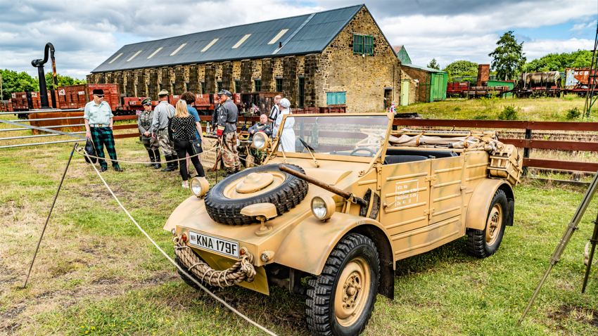 People surrinding a wartime jeep during a previous 1940s weekend event