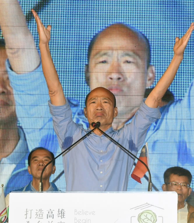 Han Kuo-yu, from the main opposition Kuomintang party, celebrates after being named mayor in Kaohsiung, a traditional stronghold of the ruling party