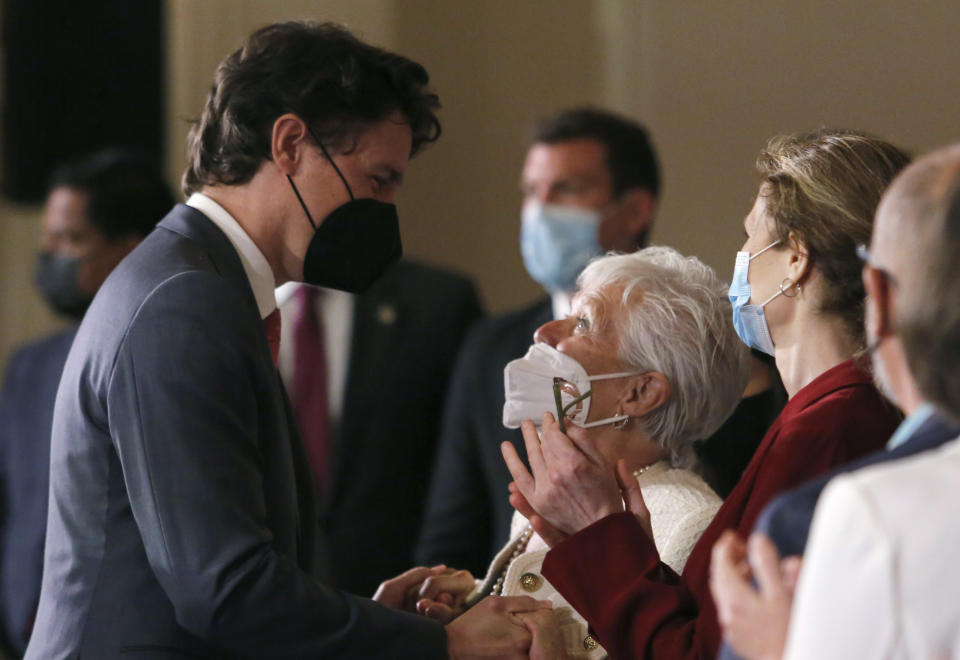 Canada's Prime Minister Justin Trudeau greets Suzanne Laplante Edward, the mother of Anne-Marie Edward, who was killed in the Montreal massacre at Ecole Polytechnique, after announcing new gun control legislation in Ottawa, Ontario, on Monday, May 30, 2022. (Patrick Doyle/The Canadian Press via AP)