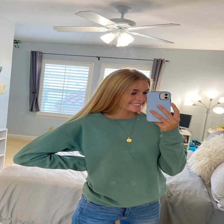 reviewer in the green crewneck