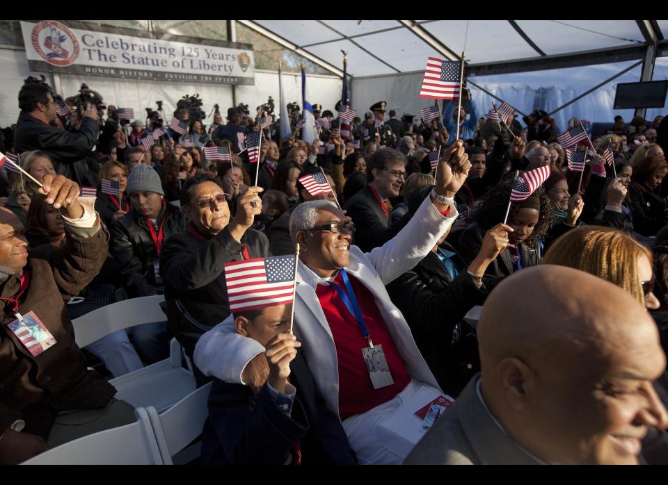 NEW YORK - OCTOBER 28:  New citizens cheer and wave at a naturalization ceremony at Liberty Island on October 28, 2011 in New York City.  125 citizens were naturalized in honor of the Statue of Liberty's 125th birthday.  (Photo by Michael Nagle/Getty Images)