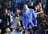 <p>Georgios Papagiannis, center, stands as he is announced as the 13th overall pick by the Phoenix Suns during the NBA basketball draft, Thursday, June 23, 2016, in New York. (AP Photo/Frank Franklin II) </p>