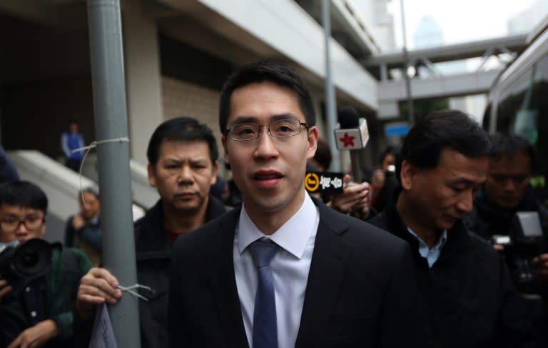 Adam Kwok (C), son of Sun Hung Kai Properties co-chairman Thomas Kwok, leaves the court after his father was sentenced to five years jail on corruption charges in Hong Kong, in 2014