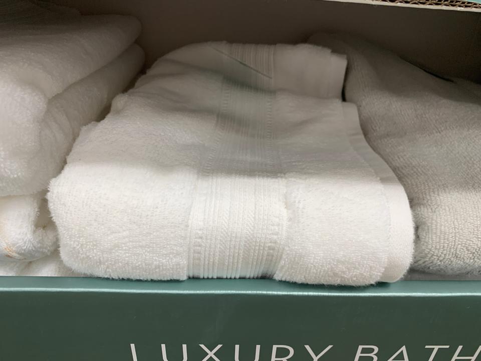 white towels in green box at costco