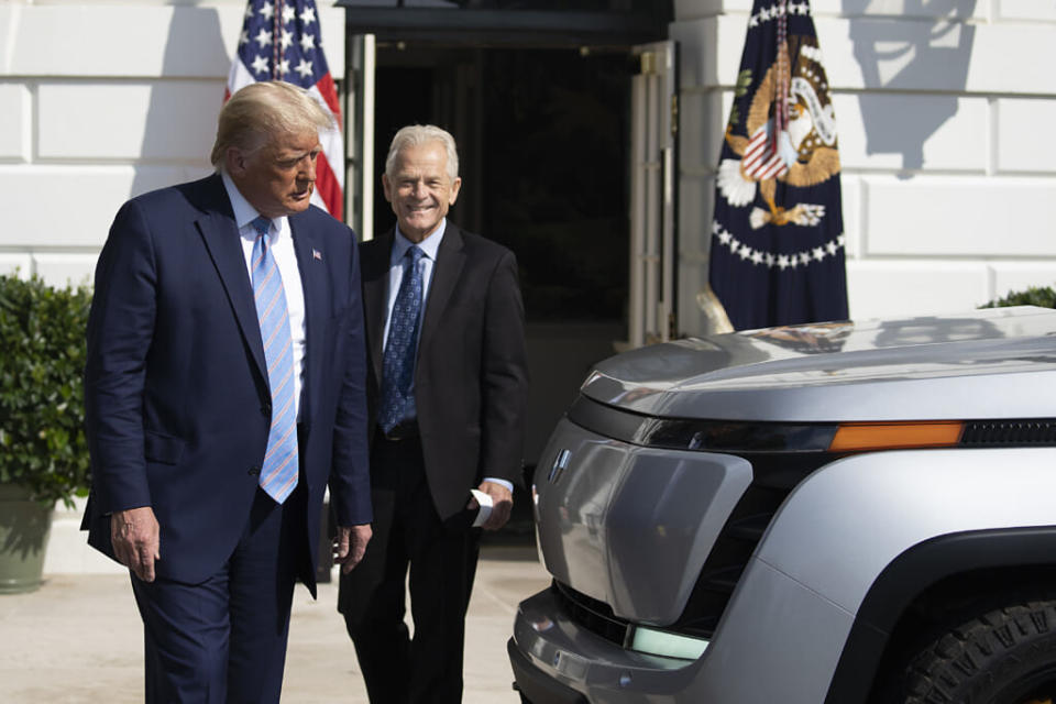 U.S. President Donald Trump and White House Trade Adviser Peter Navarro check out the new Endurance all-electric pickup truck on the south lawn of the White House on September 28, 2020 in Washington, DC. (Photo by Tasos Katopodis/Getty Images)