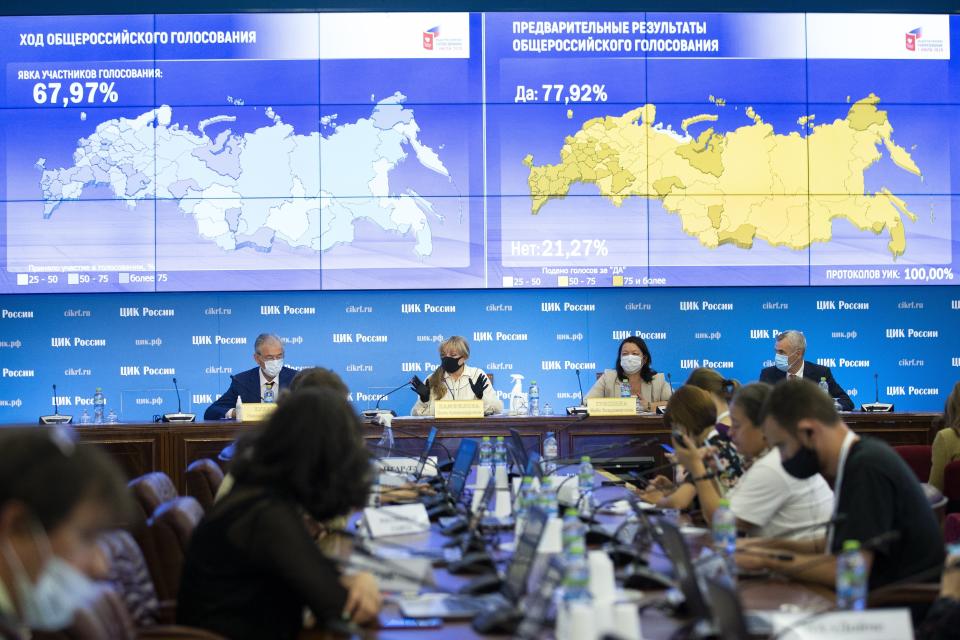 Ella Pamfilova, head of Russian Central Election Commission, wearing a face mask and gloves to protect against coronavirus, center left, gestures while speaking at a news conference in Moscow, Russia, Thursday, July 2, 2020. Almost 78% of voters in Russia have approved amendments to the country's constitution that will allow President Vladimir Putin to stay in power until 2036, Russian election officials said Thursday after all the votes were counted. Kremlin critics said the vote was rigged. (AP Photo/Alexander Zemlianichenko)