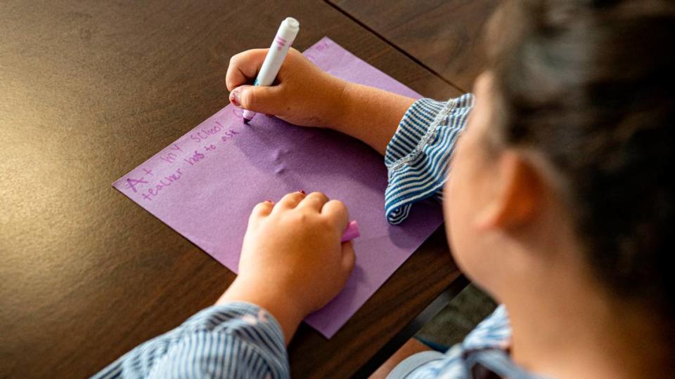 Laila Haddad, a 9-year-old Washington Elementary student, writes a letter to the legislators about her school’s need for funding through the Leandro Plan at the N.C. Legislative Building on Wednesday, June 29, 2022.