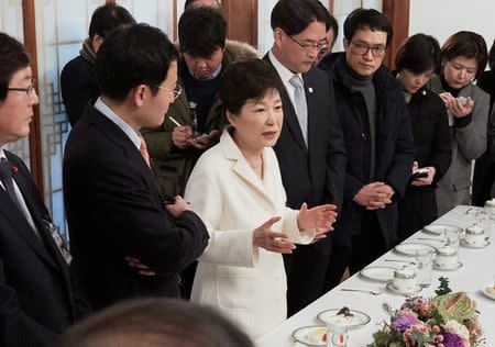 South Korean President Park Geun-hye speaks during a meeting with reporters at the Presidential Blue House in Seoul, South Korea, in this handout picture provided by the Presidential Blue House and released by Yonhap on January 1, 2017. Blue House/Yonhap via REUTERS