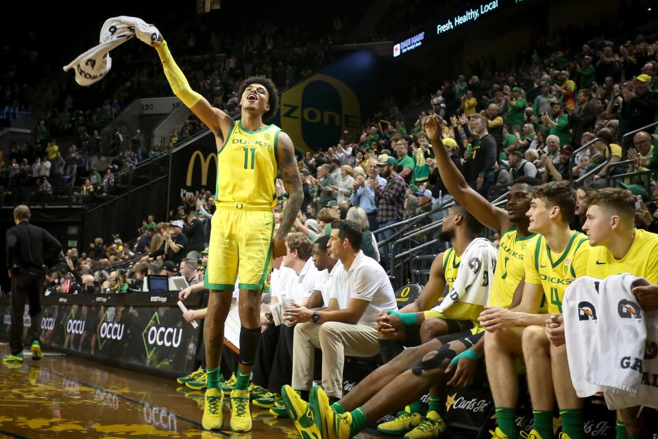 Oregon guard Rivaldo Soares sings along to “Shout”as the Oregon Ducks host the Utah Utes Saturday.