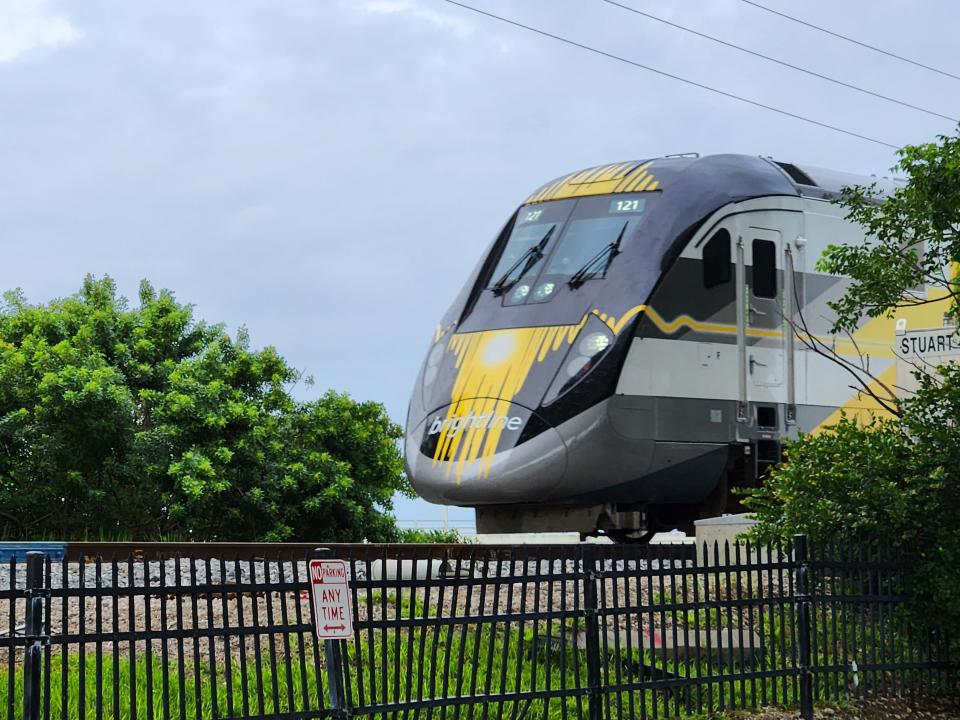 A southbound Brightline train carrying passengers from Orlando to Miami crosses the St. Lucie River railroad bridge in Stuart, Fla., on Monday, Oct. 9, 2023, the day the high-speed rail carrier increased its Miami-to-Orlando service from 16 to 30 trains daily.