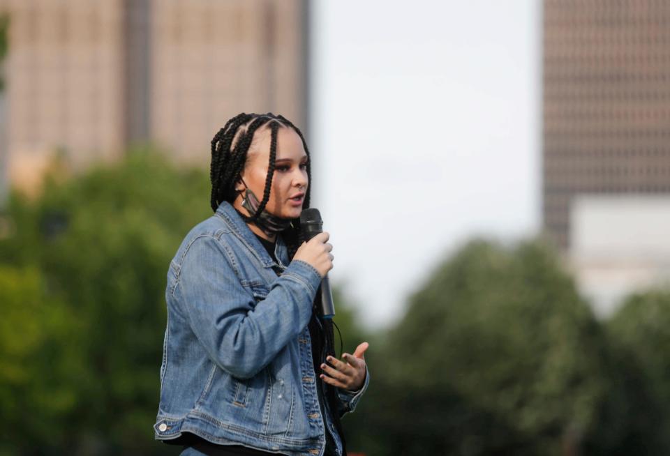 Josie Mulvilhill, a student at Norwalk High School, speaks about her experience being a person of color in a small Midwest town as central Iowans gathered in the Des Moines Sculpture Park on Tuesday, May 25, 2021, to pay respects to the memory of George Floyd, a Minneapolis resident who was murdered by a police officer.