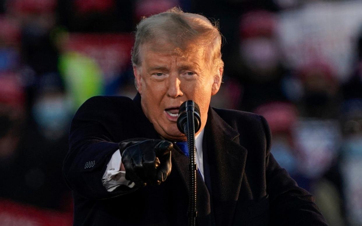 President Donald Trump speaks at a campaign rally on Tuesday in West Salem - Morry Gash/AP