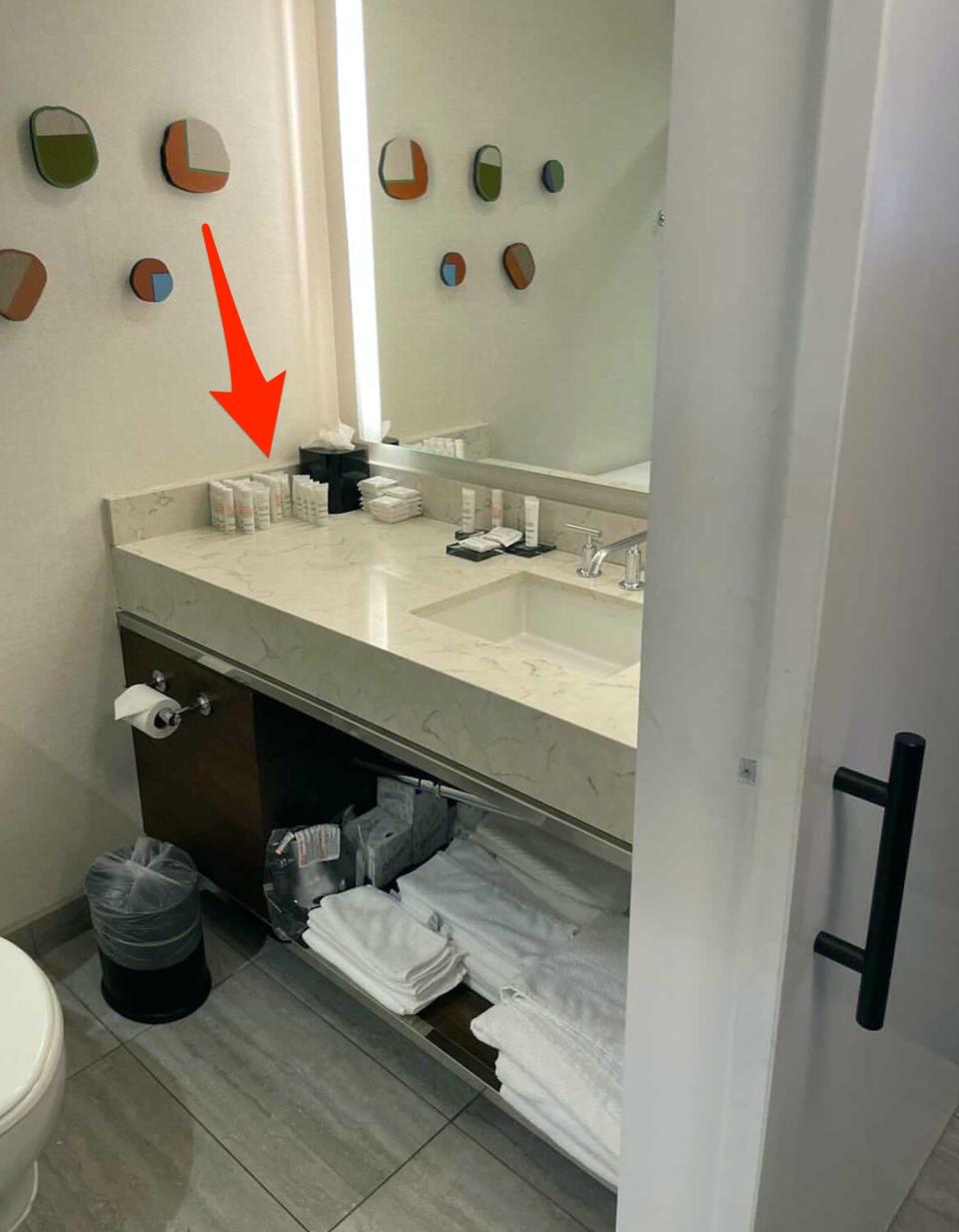 An arrow points to the stocked hotel toiletries in Cierra's crash pad.