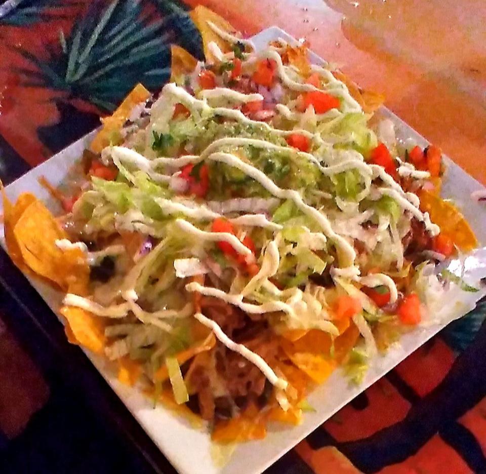 An appetizer of supreme nachos was a meal in itself.