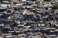 <p>A poor neighbourhood shows the damage after an earthquake measuring 7.0 rocked Port-au-Prince, the Haitian capital just before 5 pm yesterday, on Jan. 13, 2010 in Port-au-Prince, Haiti. (Photo: Logan Abassi/MINUSTAH via Getty Images) </p>