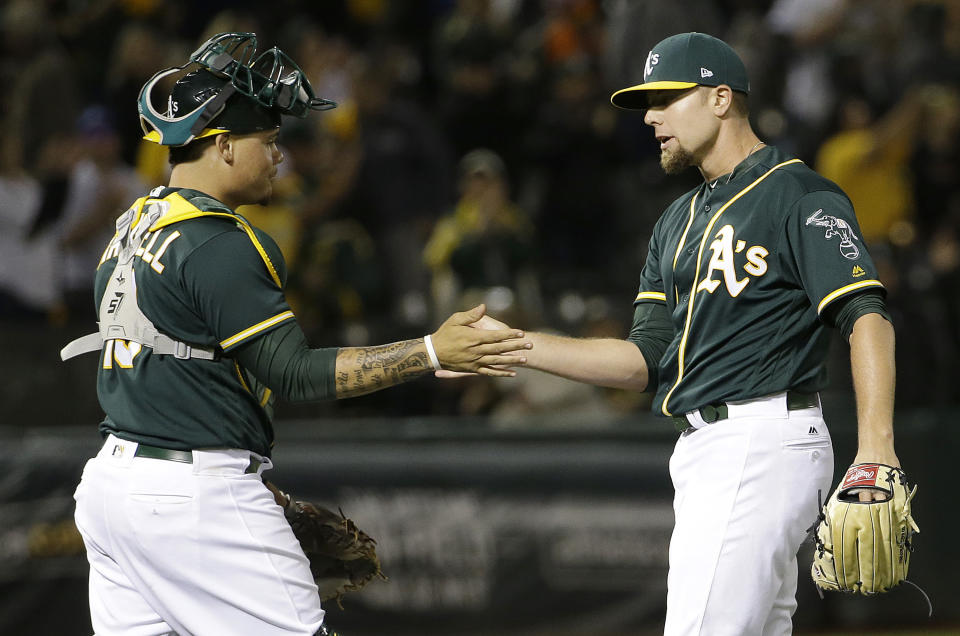 Blake Treinen (right) could be the new handshake guy in Oakland (AP)