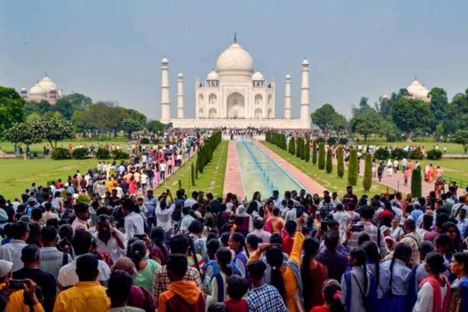 In this photograph taken on October 29, 2022, tourists visit the Taj Mahal in Agra (AFP via Getty Images)