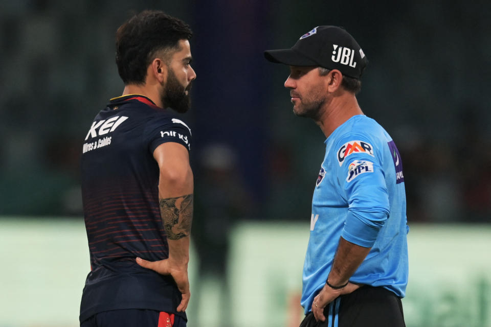 Royal Challengers Bangalore's Virat Kohli (L) talks to Delhi Daredevils coach Ricky Ponting before the start of the Indian Premier League (IPL) Twenty20 cricket match between Delhi Capitals and Royal Challengers Bangalore at the Arun Jaitley Stadium in New Delhi on May 6, 2023. (Photo by Money SHARMA / AFP) (Photo by MONEY SHARMA/AFP via Getty Images)