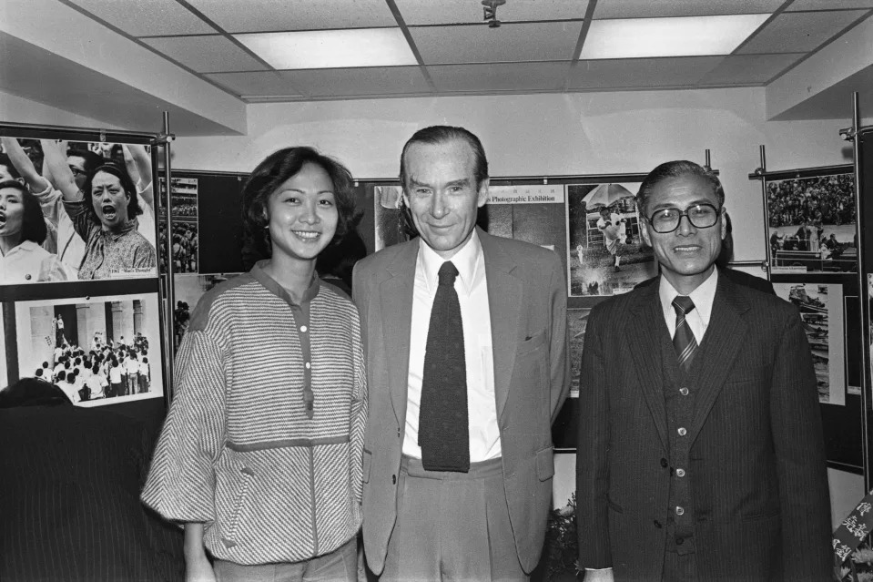 Emily Lau Wai-hing (left), a reporter of the Far Eastern Economic Review, Robin Hutcheon (centre) and Chan Kiu of the South China Morning Post posing for a group picture at Chan Kiu's press photographic exhibition. 25DEC78 (Photo by Sunny Lee/South China Morning Post via Getty Images)