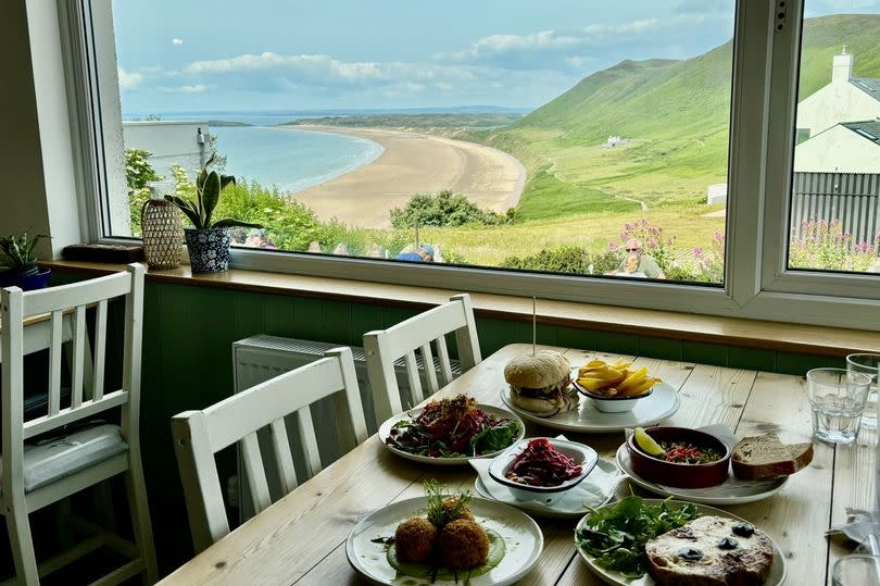 The View Rhossili serves delicious food with incredible views of Rhossili Bay | Pictured: the Signature Burger and a selection of the small plates: salad, Korean BBQ chicken, arancini, Welsh rarebit, cockles with homemade bread