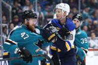 May 19, 2019; San Jose, CA, USA; San Jose Sharks defenseman Joakim Ryan (47) and St. Louis Blues defenseman Jay Bouwmeester (19) grab sweaters during the third period in Game 5 of the Western Conference Final of the 2019 Stanley Cup Playoffs at SAP Center at San Jose. Mandatory Credit: Darren Yamashita-USA TODAY Sports