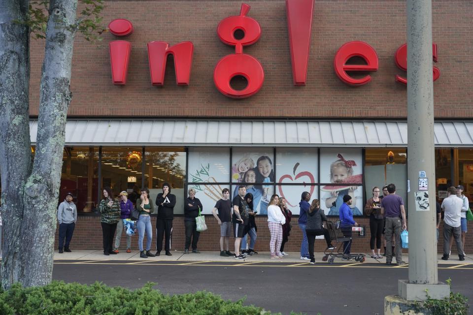 Asheville residents wait in line to enter the Ingles Markets on Haywood Road in West Asheville Sunday morning, September 29, 2024.