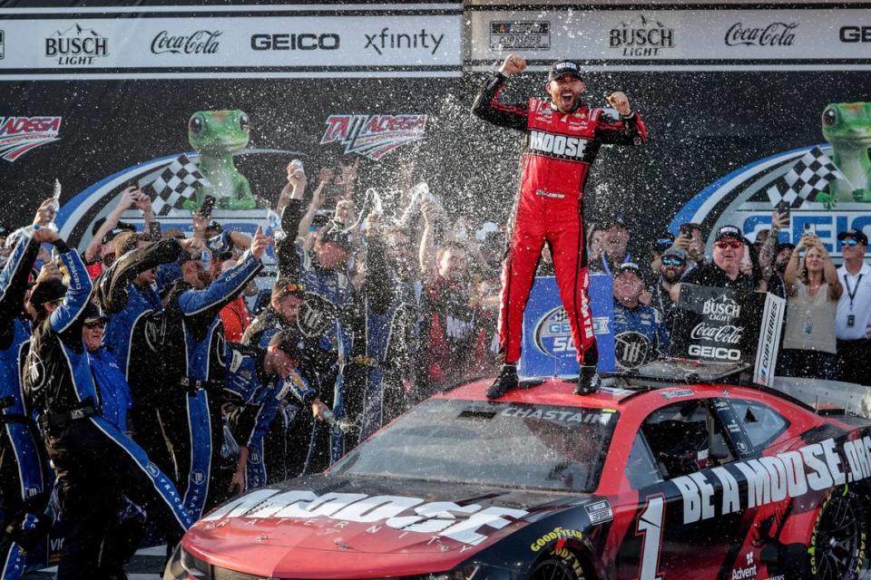 Ross Chastain, top, celebrates his win in Victory Lane after a NASCAR Cup Series auto race Sunday, April 24, 2022, in Talladega, Ala. (AP Photo/Butch Dill) Butch Dill/AP