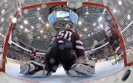 Latvia's goalie Kristers Gudlevskis reacts after a goal of the U.S. during their men's ice hockey World Championship Group B game at Minsk Arena in Minsk May 15, 2014. REUTERS/Alex Kudenko/Pool