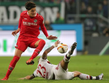 Football Soccer - Hanover 96 v Bayern Munich - German Bundesliga - HDI Arena, Hanover, Germany- 19/12/15 Hanover 96's Miiko Albornoz and Bayern Munich's Arturo Vidal in action. REUTERS/Fabian Bimmer