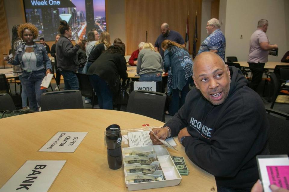 Johnny Waller, who advocates for the those formerly incarcerated, played the part of a banker and grocer during the Western Region Probation and Parole reentry simulation at the Kauffman Foundation Conference Center. Showing those who’ve recently come out of prison how to navigate life on the outside is one of the many things Waller does as an advocate for providing second chances.