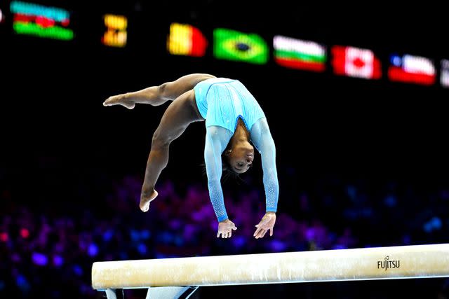 <p>Matthias Hangst/Getty</p> Simone Biles of the Team United States competes on Balance Beam during Women's Qualifications on Day Two of the FIG Artistic Gymnastics World Championships in Antwerp, Belgium