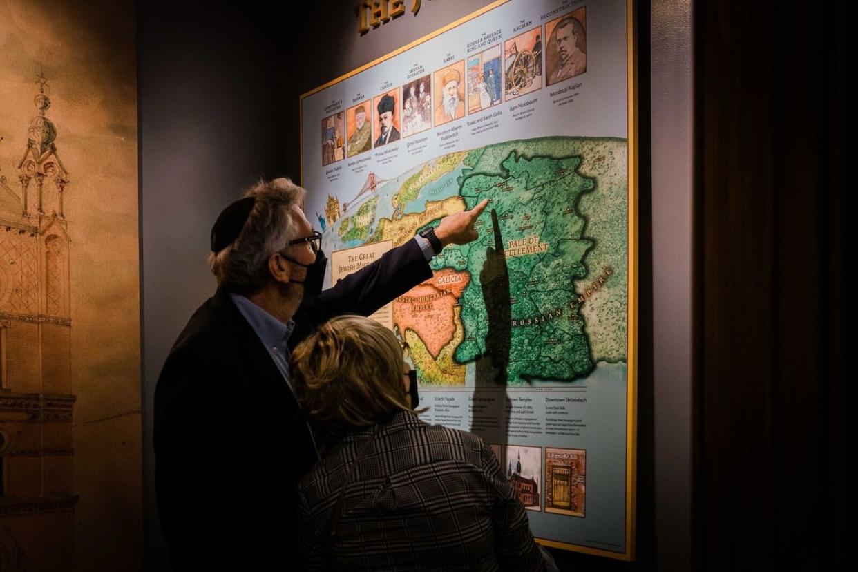 a person pointing to a map