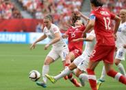 Jun 27, 2015; Vancouver, British Columbia, CAN; England midfielder Jade Moore (11) fouls Canada defender Allysha Chapman (15) during the second half in the quarterfinals of the FIFA 2015 Women's World Cup at BC Place Stadium. Mandatory Credit: Matt Kryger-USA TODAY Sports