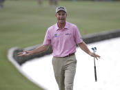 Jim Furyk gestures as he is about to play the 18th hole and the alarm sounds temporarily suspending play due to approaching thunderstorms during the final round of The Players championship golf tournament at TPC Sawgrass, Sunday, May 11, 2014 in Ponte Vedra Beach, Fla. (AP Photo/Lynne Sladky)