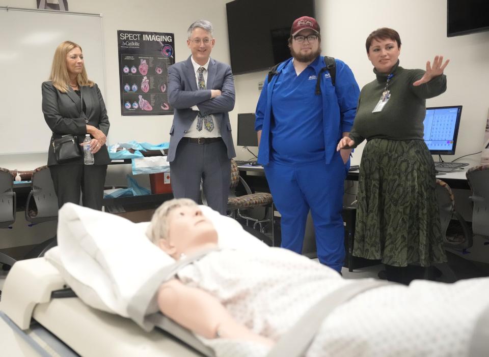 GateWay Community College nuclear medicine faculty member Julie Bolin (right) gives a tour to school president Amy Diaz (from left), Undersecretary of Education James Kvaal and student Zach Edwards in Phoenix on Jan. 22, 2024.