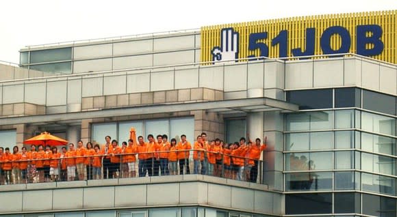 51job headquarters with employees on an outdoor terrace.