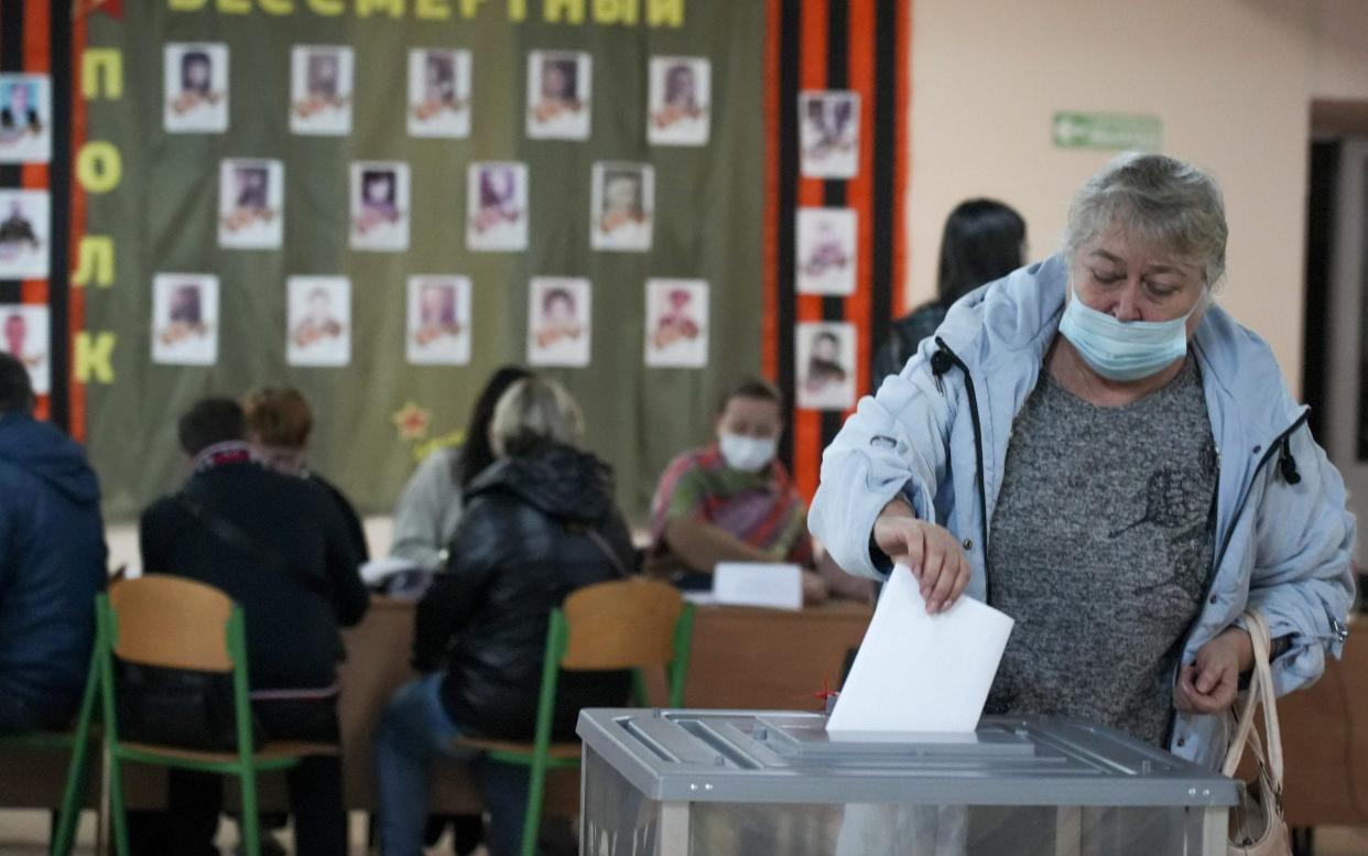DONETSK, UKRAINE - SEPTEMBER 27: People cast their votes in controversial referendums in Donetsk, Ukraine on September 27, 2022. Voting runs from Friday to Tuesday in Luhansk, Donetsk, Kherson and Zaporizhzhia, with people asked to decide if they want these regions to become part of Russia. (Photo by Stringer/Anadolu Agency via Getty Images)  - Stringer/Anadolu Agency via Getty Images