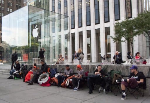 Customers hoping to buy the new iPhone 5 line up outside the Apple store on Fifth Avenue in New York on September 17. Apple received more than two million orders for its new iPhone 5 in just 24 hours, the company said, pushing back many deliveries into October because of unprecedented demand