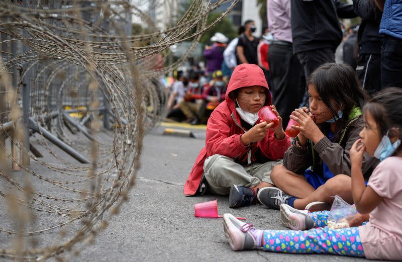 Members of indigenous communities and supporters of Ecuador's presidential candidate Yaku Perez gather outside the Electoral National Council (CNE) in Quito